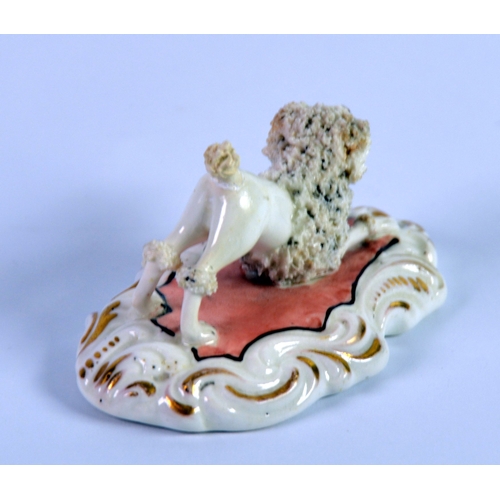 129 - NINETEENTH CENTURY STAFFORDSHIRE PORCELAIN MODEL OF A CLIPPED POODLE, modelled with raised back legs... 