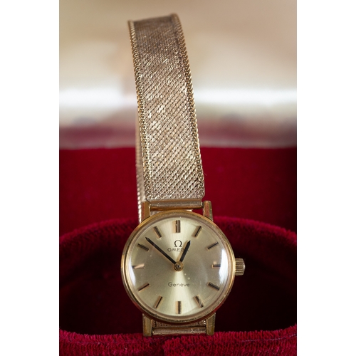 8 - LADY'S OMEGA WRIST WATCH with gold-plated case, circular silvered dial with batons and 9ct gold meta... 