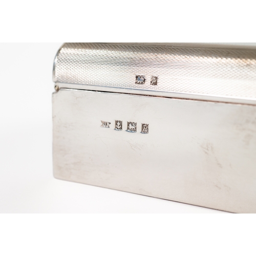 481 - ENGINE TURNED SILVER CLAD TABLE CIGARETTE BOX, with hardwood lined interior and rounded ends to the ... 