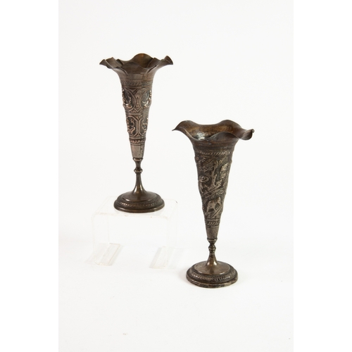 532 - NEAR PAIR OF ANGLO INDIAN WEIGHTED AND EMBOSSED ELECTROPLATED TRUMPET VASES, each of typical form wi... 