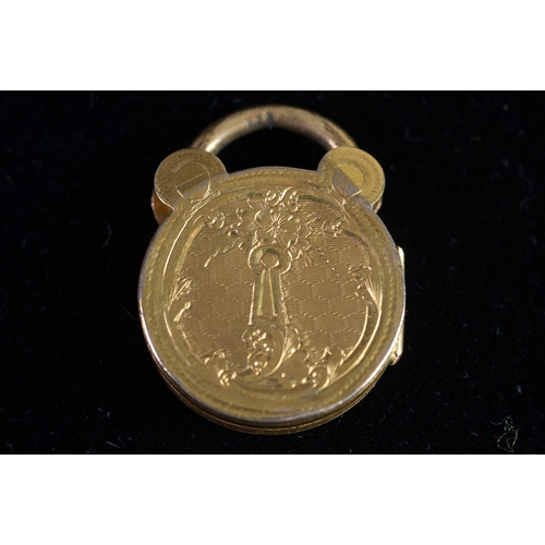 120 - VICTORIAN WELL ENGRAVED CIRCULAR PADLOCK PATTERN LOCKET with gold back and front, 3/4