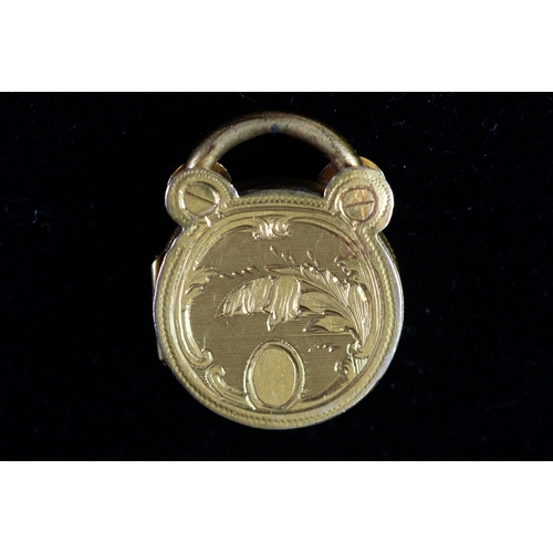 120 - VICTORIAN WELL ENGRAVED CIRCULAR PADLOCK PATTERN LOCKET with gold back and front, 3/4