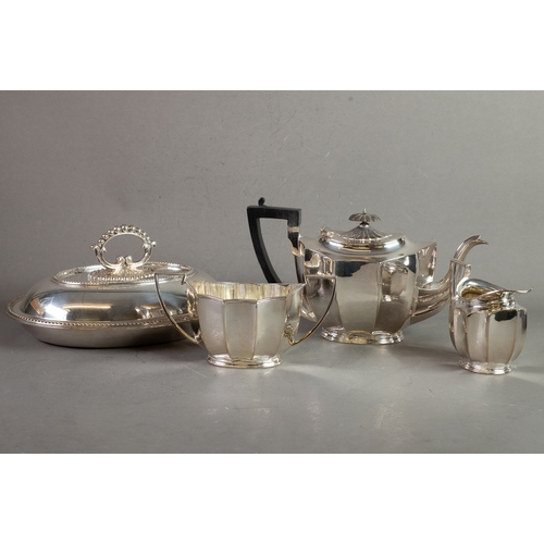 517 - THREE PIECE ELECTROPLATED TEASET, of oval panelled form with black angular scroll handles and oval b... 