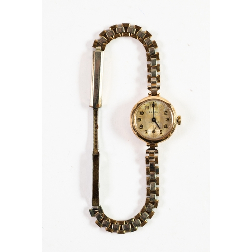 25 - LADY'S ENSIGN 9ct GOLD CASED WRISTWATCH, with mechanical movement, small silvered arabic dial, with ... 