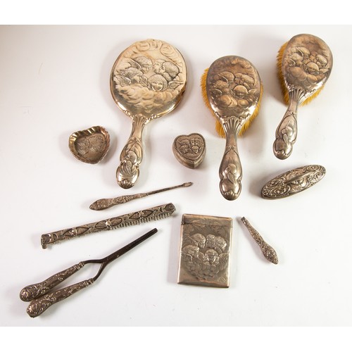 486 - ELEVEN PICES OF SILVER EMBOSSED WITH REYNOLD’S ANGELS, comprising: DRESSING TABLE HAND MIRROR, Sheff... 