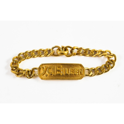 93 - CHINESE GOLD IDENTITY BRACELET with flattened curb pattern links, the panel embossed Y.C. EILEEN, (t... 