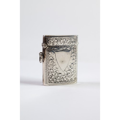 499 - LATE VICTORIAN SILVER VESTA BOX, oblong and oval section, engraved with foliate scroll, 2 1/8