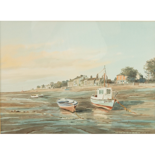 286 - P J HARGREAVES (TWENTIETH/TWENTY FIRST CENTURY)WATERCOLOUR Coastal town at low tide with small boats... 