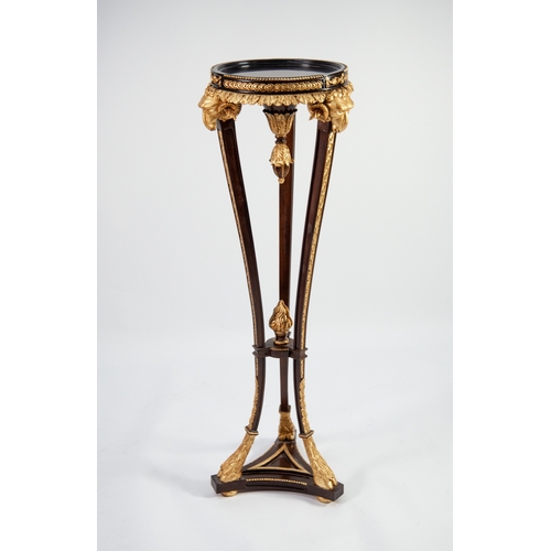 62 - BRIGHTS OF NETTLEBED REGENCY STYLE CARVED DARK MAHOGANY AND PARCEL GILT RAM'S HEAD TORCHERE, with ci... 