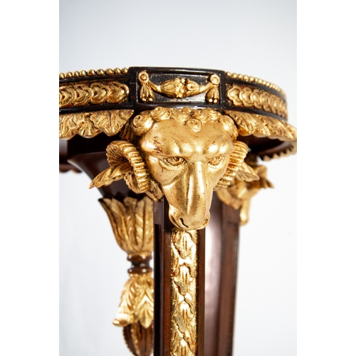 62 - BRIGHTS OF NETTLEBED REGENCY STYLE CARVED DARK MAHOGANY AND PARCEL GILT RAM'S HEAD TORCHERE, with ci... 