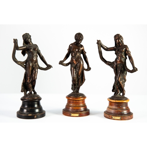 49 - SET OF THREE EARLY TWENTIETH CENTURY CAST COPPER FIGURES, cast as female figures dancing, on turned ... 