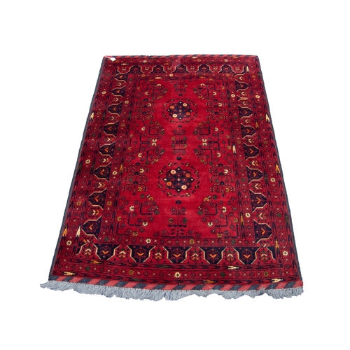 3 - GOOD QUALITY TURKOMAN BALOUCHI RUG, wine red with two circular floral medallions and a delicate patt... 