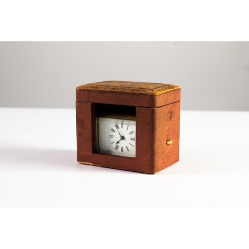 33 - EARLY TWENTIETH CENTURY BRASS SMALL CARRIAGE CLOCK IN ASSOCIATED RED CLOTH TRAVELLING CASE, the cloc... 