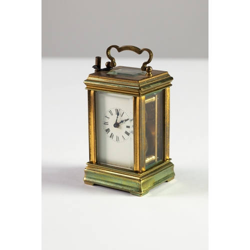 38 - EARLY TWENTIETH CENTURY BRASS CASED SMALL CARRIAGE CLOCK, of typical form with oblong top glass, 3 ½... 