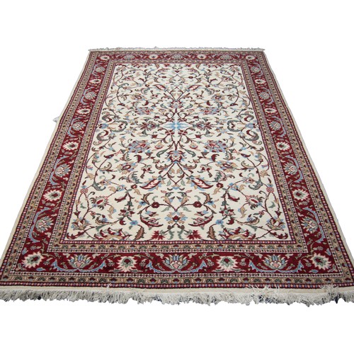 10 - TURKISH ISPARTA HAND MADE CARPET, off white with multi-coloured formal floral and foliate scroll pat... 