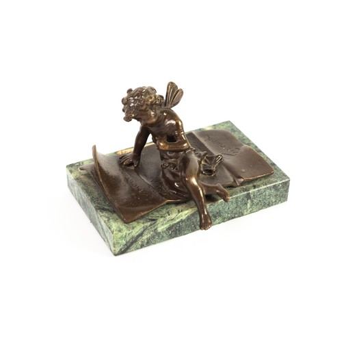 52 - ERNEST JUSTIN FERRAND (1846-1942) FRENCH BRONZE CUPID FIGURE WRITING A LETTER, signed, mounted on ob... 