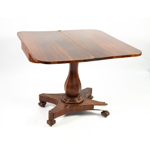 81 - WILLIAM IV ROSEWOOD FOLD OVER TEA TABLE, plain top with rounded corners raised on baluster form colu... 