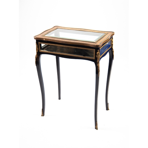 103 - EARLY 20TH CENTURY BOULLE INLAID AND EBONIZED WOOD ORNATE BIJOUTERIE TABLE, the hinge top with serpe... 