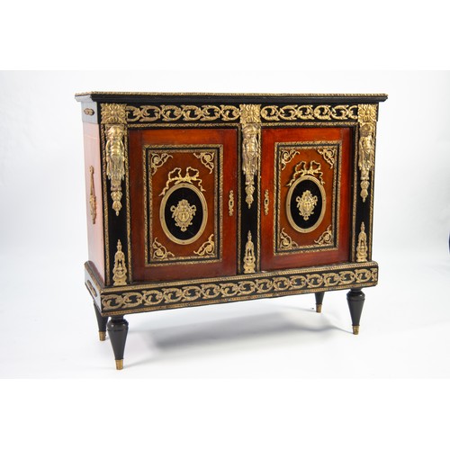 105 - LOUIS XIV STYLE KINGWOOD AND EBONIZED WOOD TWO DOOR PIER OR SIDE CABINET, applied with all over gilt... 