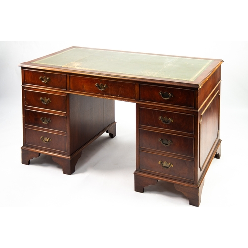 106 - GEORGIAN STYLE MAHOGANY PEDESTAL DESK with tooled green leather inlet top having three frieze and si... 