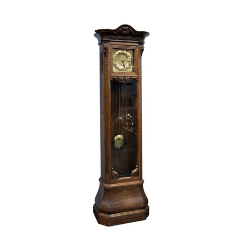 24 - MODERN CARVED OAK LONGCASE CLOCK, the 10 ½” Arabic brass dial with embossed spandrels, powered by a ... 