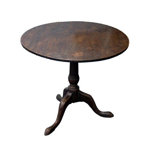 76 - GEORGE III 18TH CENTURY MAHOGANY TRIPOD TABLE, having plain one piece circular top on gun barrel tur... 