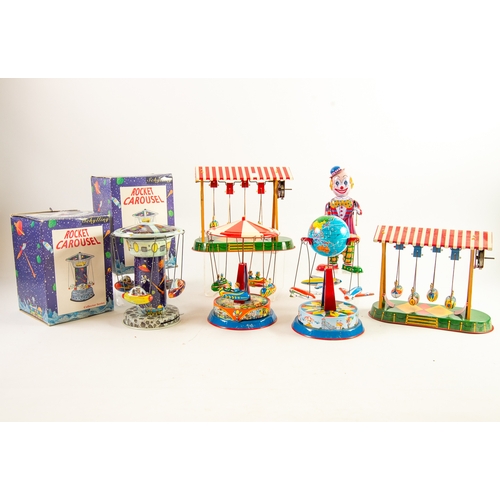 377 - TWO MODERN BOXED LITHOGRAPH TIN PLATE TOYS IN THE FORM OF FAIRGROUND RIDES, with four rocking gondol... 