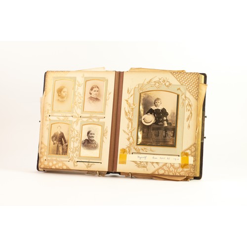 138 - LATE VICTORIAN EMBOSSED LEATHER PHOTOGRAPH ALBUM containing a selection of cabinet photographs, fami... 