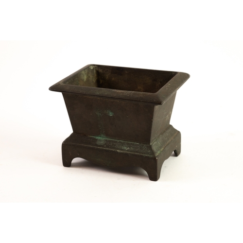 241 - 19TH CENTURY CHINESE CAST BRONZE CENSER of SARCOPHOGUS FORM with everted rim and raised on base with... 