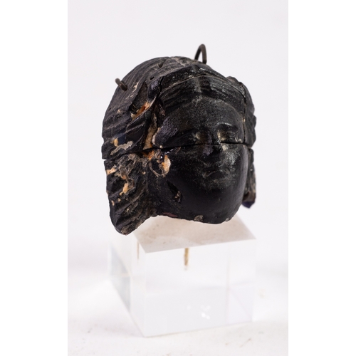 65 - CULTURE ROMAN 1st CENTURY AD, FRAGMENT FROM A DARK BLUE GLASS PHALERA, in the form of a female head,... 