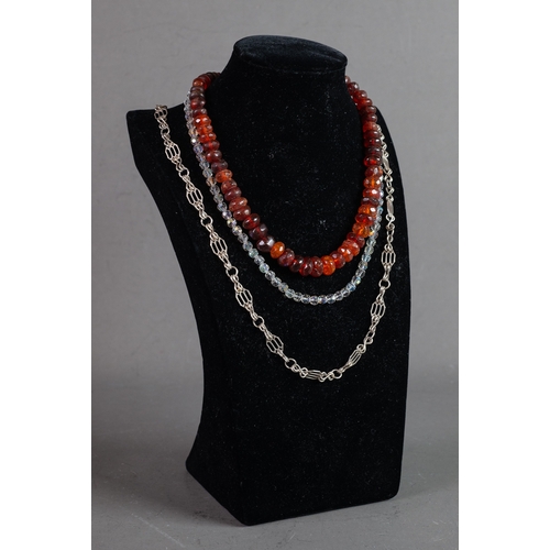 463 - SINGLE STRAND NECKLACE OF GRADUATED AND FACETED RED AMBER COLOURED BEADS; A SINGLE STRAND NECKLACE O... 