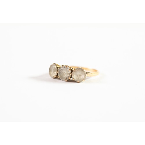 493 - 9ct GOLD RING, claw set with three spinels, 2.8gms