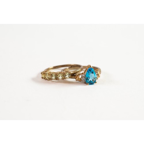 502 - 9ct GOLD RING set with tear shaped blue topaz with two tiny diamonds to each shoulder; and 9ct GOLD ... 