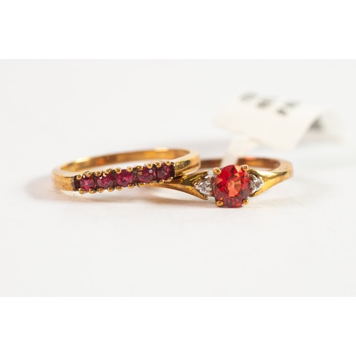 504 - 9ct GOLD RING set with a tear shaped ruby and a tiny white stone to each shoulder; and a 9ct GOLD RI... 