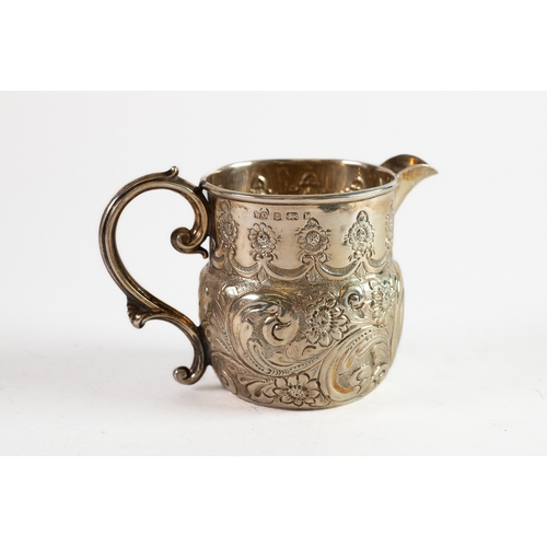 352 - EDWARD VII EMBOSSED SILVER CREAM JUG, with fancy scroll handle and plain moulded border, decorated w... 