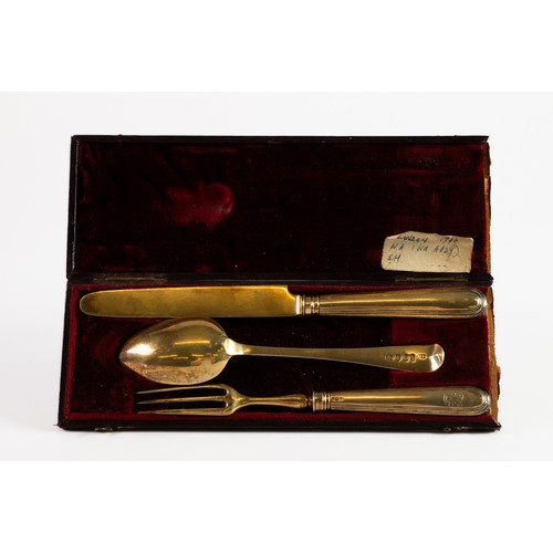 355 - GEORGE III CASED THREE PIECE SILVER GILT CHILD’S CUTLERY SET, the fork and knife with filled handles... 