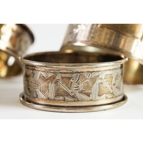 356 - FIVE EDWARD VII AND LATER SILVER NAPKIN RINGS, including an ivy leaf engraved pair, 2.30ozt, (5)