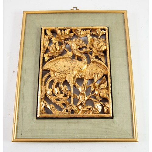 416 - SOUTH EAST ASIAN CARVED AND PIERCED GIFTWOOD PANEL depicting Asiatic Pheasant amongst foliage, 10