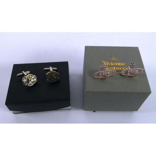 484 - PAIR OF VIVIENNE WESTWOOD STUD EARRINGS and a PAIR OF CUFFLINKS MOUNTED WITH WATCH PARTS, both boxed... 