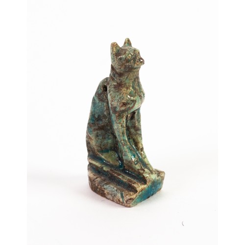 74 - ANCIENT EGYPTIAN GREY GLAZED FAIENCE WELL MODELLED MINIATURE FIGURE OF A SEATED CAT, on oblong base,... 