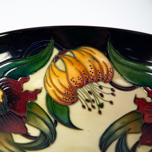 37 - NICOLA SLANEY FOR MOORCROFT POTTERY, SECOND QUALITY ‘ANNA LILY’ PATTERN FRUIT BOWL, decorated in col... 