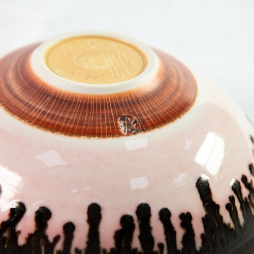 9 - PETER WILLIS STUDIO PORCELAIN BOWL, of footed form, decorated in pink with copper oxide runnings to ... 