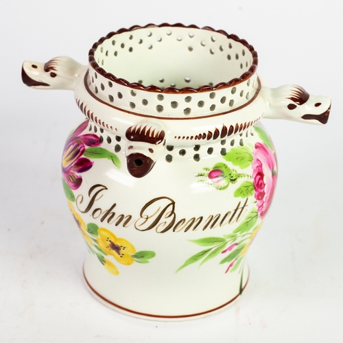 60 - NINETEENTH CENTURY BRISTOL CREAM WARE POTTERY SMALL PUZZLE JUG, of baluster form with loop handle an... 