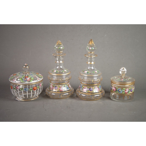 215 - FOUR ITEMS OF LATE 19TH CENTURY CLEAR GLASS enamelled with flowers enriched with gilding, comprising... 