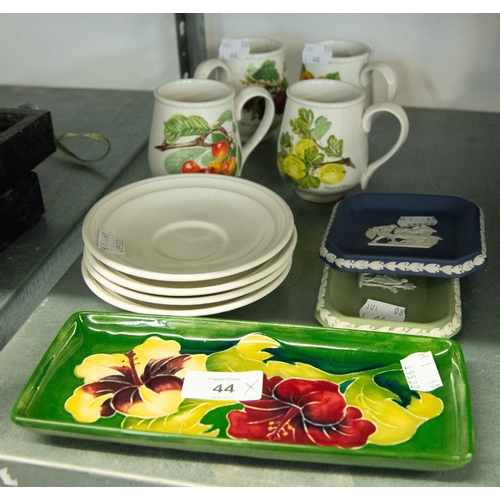 52 - MOORCROFT POTTERY OBLONG PIN TRAY; FOUR PORTMEIRION POTTERY CUPS AND SAUCERS AND TWO WEDGWOOD DISHES... 