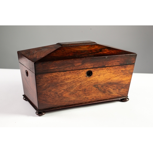 84 - VICTORIAN ROSEWOOD TEA CADDY, of sarcophagus form with bun feet, the interior with a pair of removab... 