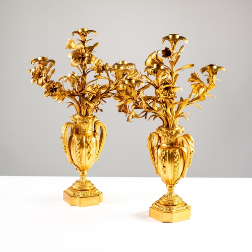 66 - PAIR OF NINETEENTH CENTURY ORMULU FIVE LIGHT CANDELABRA, each modelled as lily type flowers issuing ... 