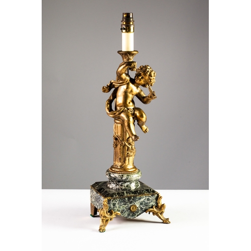 67 - GILT METAL AND BLACK VEINED MARBLE FIGURAL TABLE LAMP, modelled with a Bacchanalian cherub on a flut... 