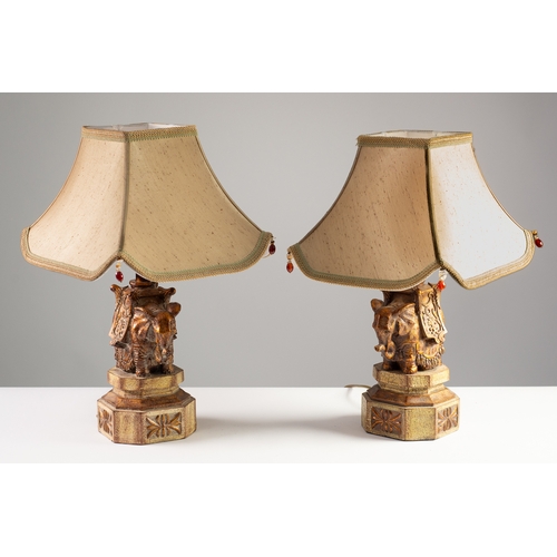 78 - PAIR OF MODERN CEREMONIAL ELEPHANT PATTERN COMPOSITION TABLE LAMPS, each modelled on a canted oblong... 