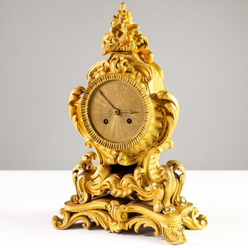 106 - MID NINETEENTH CENTURY FRENCH WELL CAST BRONZE DORE MANTEL CLOCK IN ROCOCO TASTE, the movement stamp... 